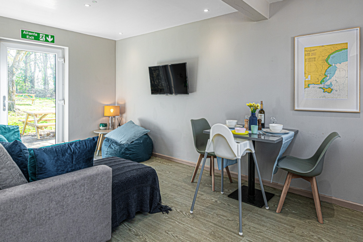a living room filled with furniture and a window