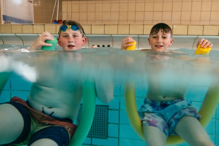 a person lying in a pool