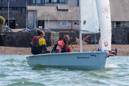 a group of people riding on the back of a boat