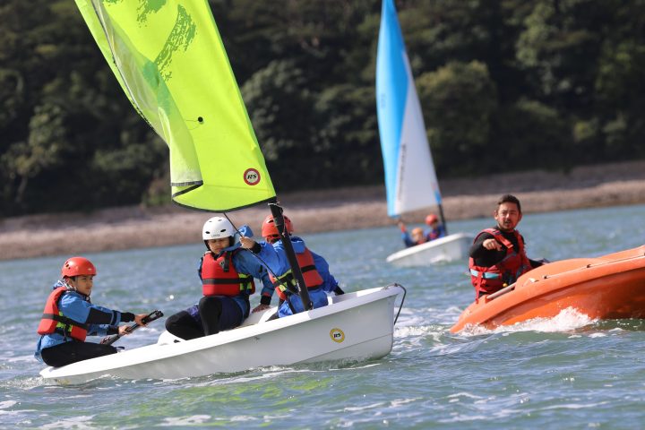 a group of people riding on the back of a boat