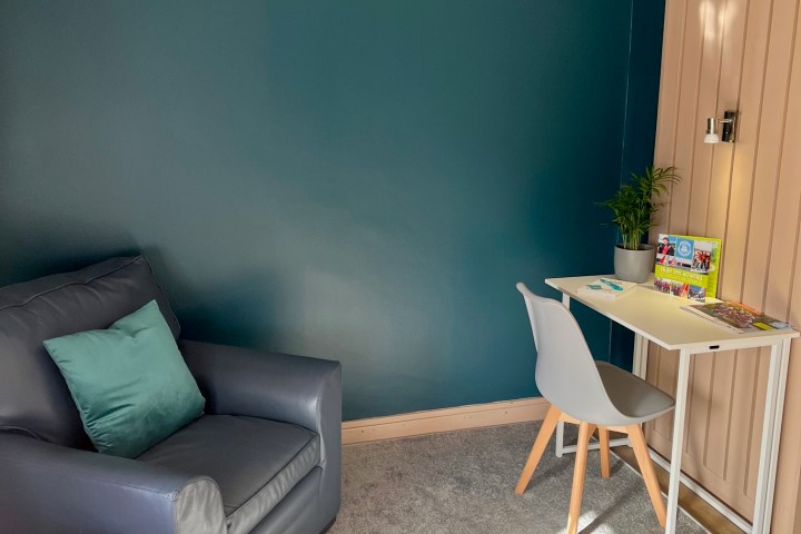 a living room with a leather chair