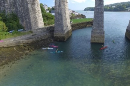 a stone bridge over a body of water