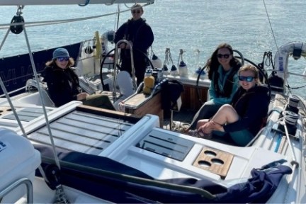 a group of people on a boat in the water