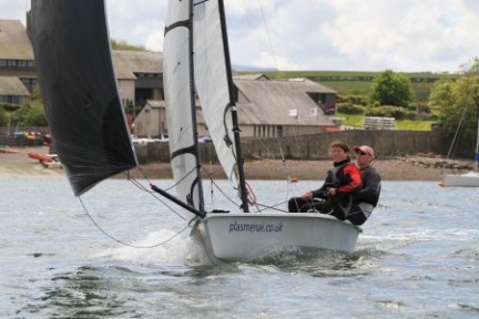 a man riding on the back of a boat