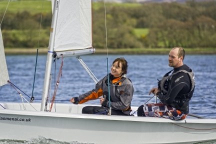 a group of people on a boat in the water