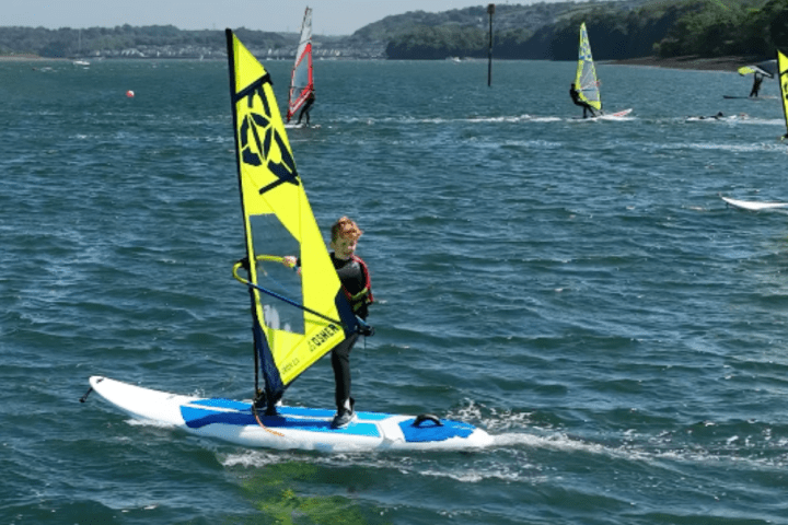 a person kite surfing in the ocean