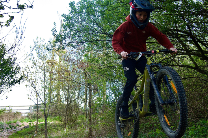 a man riding on the back of a bicycle