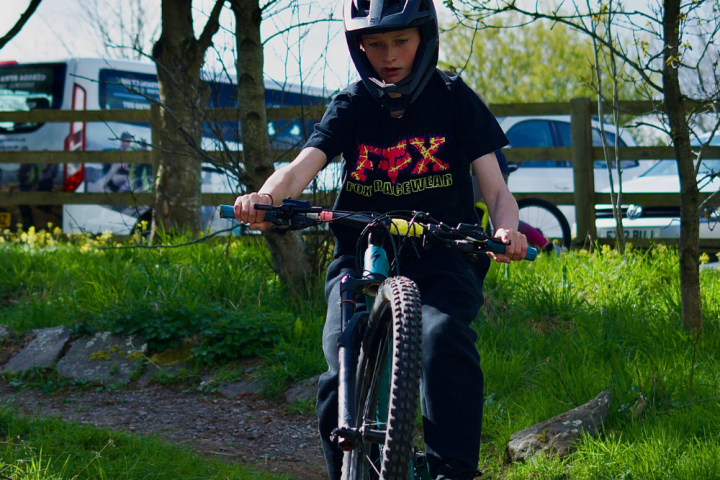 a man riding on the back of a bicycle