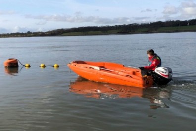 a small boat in a body of water