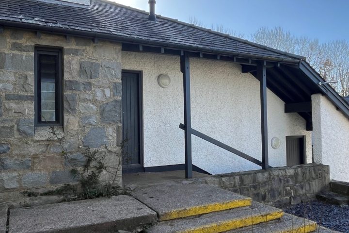 a bench in front of a house