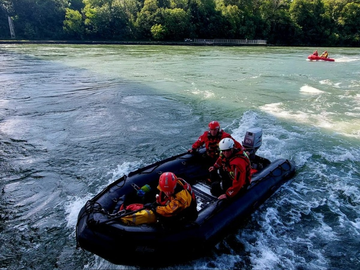 a man on a raft in a body of water
